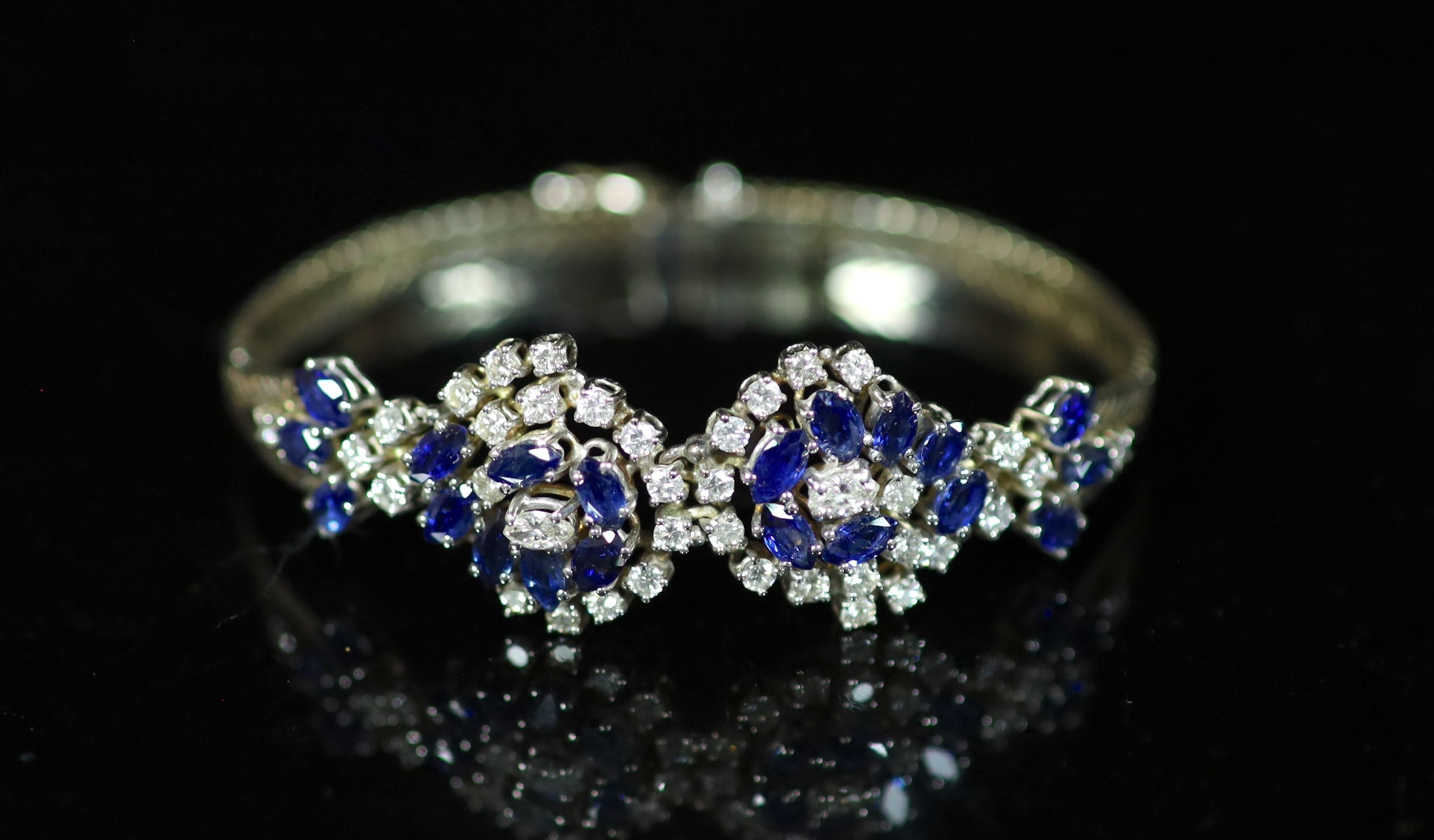 A 18ct white gold sapphire and diamond set double cluster bracelet